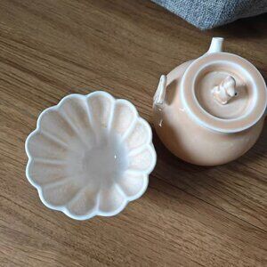 Simple ceramic cup with a matching sauce